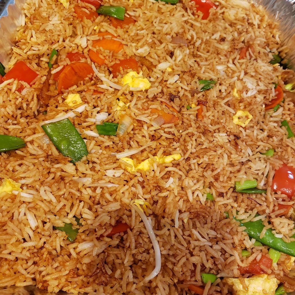 Fried rice with vegetables, eggs, and sprouts